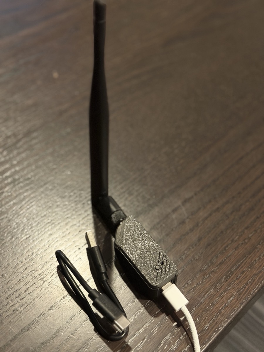 RoostOS running on a XIAO ESP32-S3 board with antenna, powered over USB-C